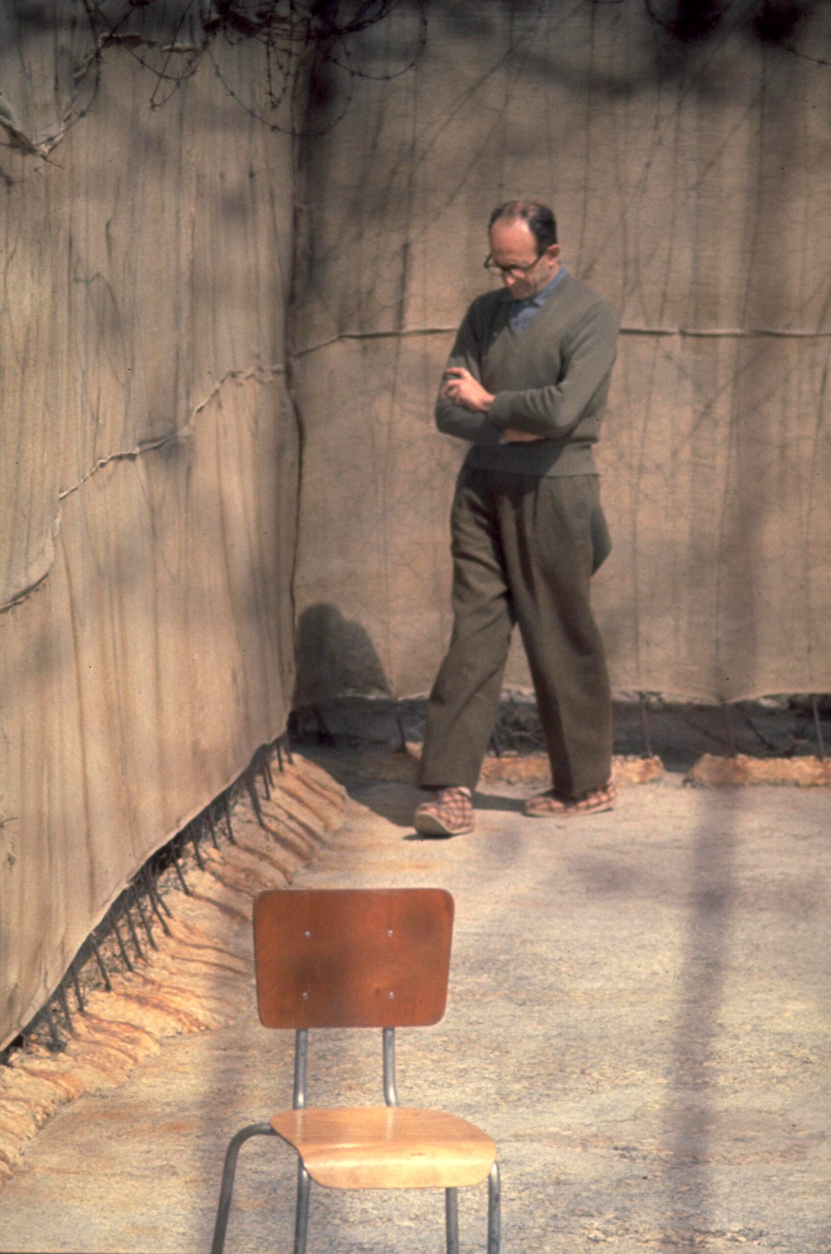 Adolf Eichmann pacing in the yard of Ayalon Prison in Israel, 1961.