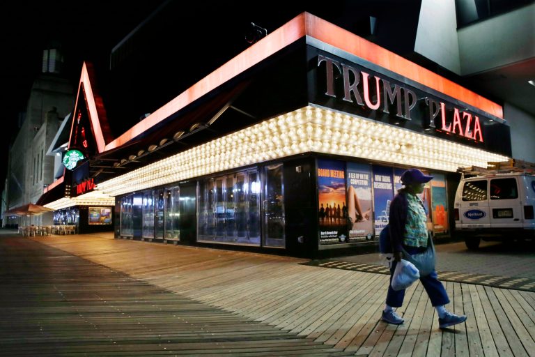 FILE - In this Sept. 16, 2014 file photo, a woman walks past Trump Plaza Hotel & Casino on The Boardwalk in Atlantic City, N.J. Ivanka Trump tells The Associated Press that Trump Entertainment Resorts will begin removing letters spelling out the Trump name on the casino's exterior on Monday, Oct. 6, 2014. (AP Photo/Mel Evans, File)