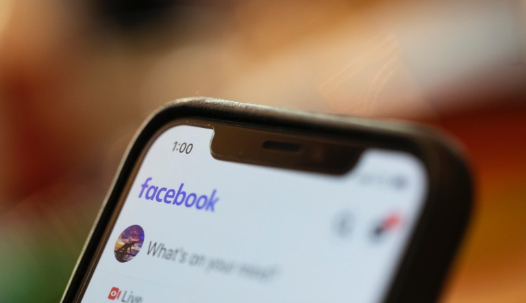 In this Sunday, Aug. 11, 2019, photo an iPhone displays a Facebook page in New Orleans.  