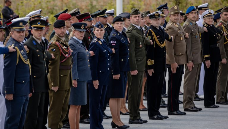 Military personnel from member states stand to attention during the North Atlantic Treaty Organization (NATO) summit at the military and political alliance's headquarters in Brussels, Belgium, on Wednesday, July 11, 2018. President Donald Trump opened up another front in his tussle with allies on his arrival at NATOâs annual summit, targeting Germany over its support for the Nord Stream 2 gas pipeline from Russia.