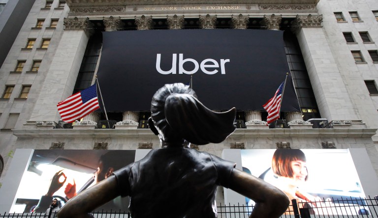 The statue of Fearless Girl stands in front of the New York Stock Exchange before Uber, the world's largest ride-hailing service, holds its initial public offering, Friday, May 10, 2019.