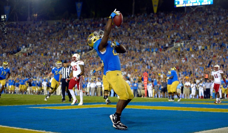 UCLA running back Johnathan Franklin celebrates after scoring a touchdown during the second half of their NCAA football game against Nebraska, Saturday, Sept. 8, 2012, in Pasadena, Calif. UCLA won 36-30.