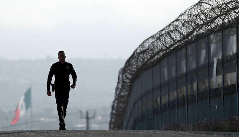 Trump busts congressional gridlock, moving wall brawl into court