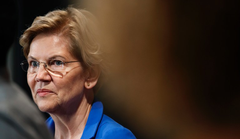 Sen. Elizabeth Warren, D-Mass., listens to a student talk about his student loan debt.