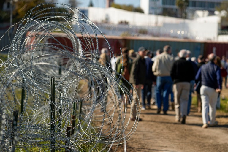 Republicans outside the room are skeptical of deal giving Biden power to shut down border