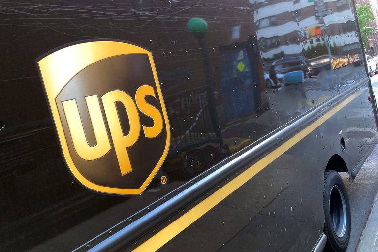 A United Parcel Service truck is parked on a street, in New York, Thursday, May 11, 2023. Shares of UPS are falling before the market open on Tuesday, Jan. 30, 2024, as the package delivery company gave a weaker-than-expected full-year revenue forecast. (AP Photo/Richard Drew, File)