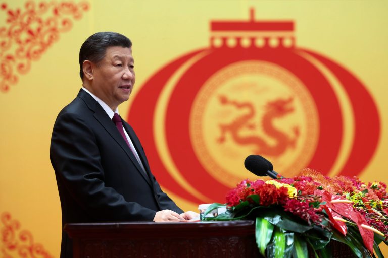 Chinese President Xi Jinping stands at a podium.