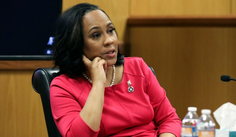 Fani Willis tells appeals court to keep her on Trump RICO case