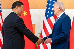 President Joe Biden, right, and Chinese President Xi Jinping shake hands before a 2022 summit in Indonesia.