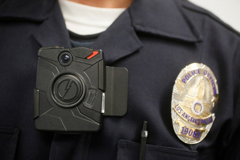 FILE - A Los Angeles Police officer wears an on-body cameras. (AP Photo/Damian Dovarganes,File)