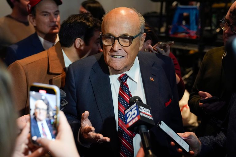 Rudy Giuliani speaks to reporters after Republican presidential candidate former President Donald Trump spoke at a primary election night party in Nashua, N.H., Tuesday, Jan. 23, 2024. (AP Photo/Matt Rourke)
