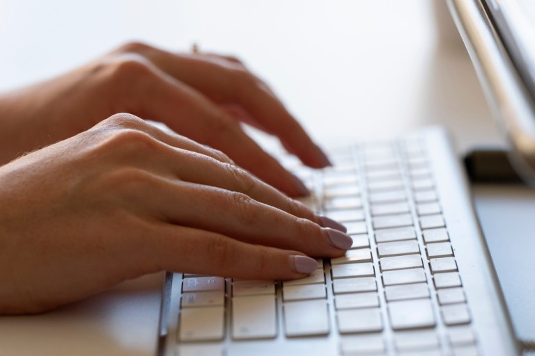 A person types on a keyboard, Thursday, June 6, 2024, in Portland, Oregon. (AP Photo/Jenny Kane)