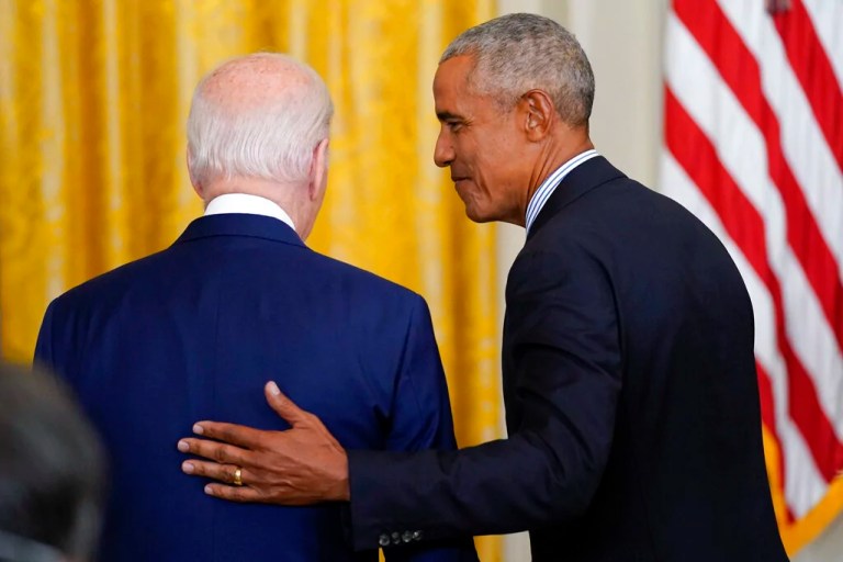 Former President Barack Obama guides President Joe Biden.