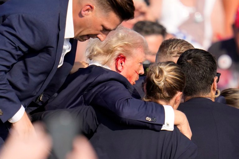 Trump evacuated from rally after shots fired in apparent assassination attempt