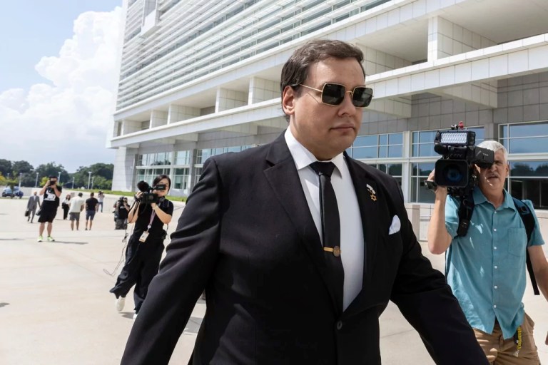 Former U.S. Rep. George Santos arrives at court in Central Islip, N.Y., Monday, Aug., 19, 2024. (AP Photo/Stefan Jeremiah)
