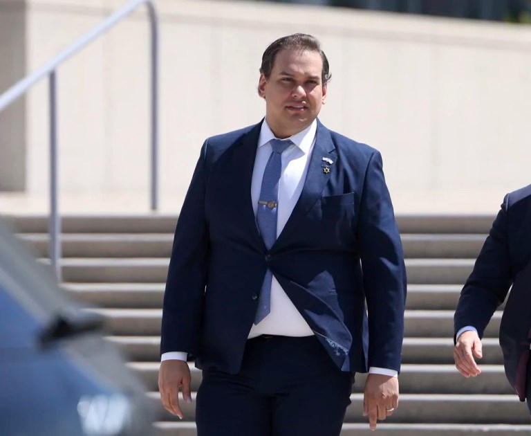 George Santos walks down U.S. Capitol steps