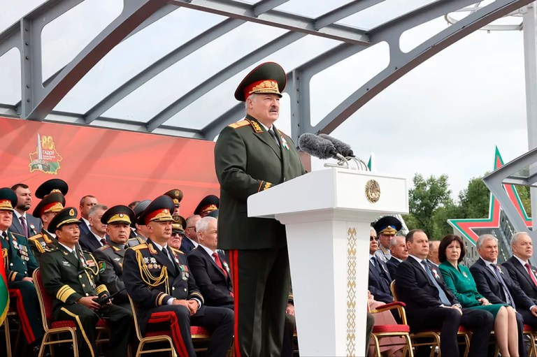 Belarusian President Alexander Lukashenko speaks at a podium.