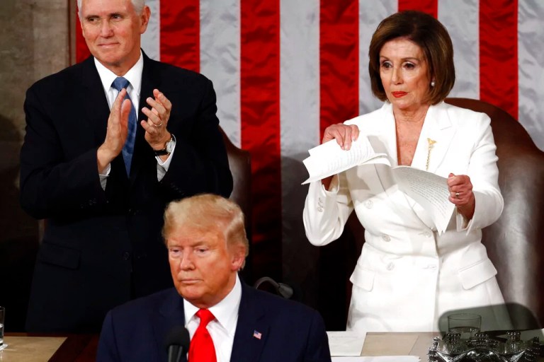 House Speaker Nancy Pelosi of Calif., tears her copy of President Donald Trump's s State of the Union address after he delivered it to a joint session of Congress on Capitol Hill in Washington, Tuesday, Feb. 4, 2020. Vice President Mike Pence is at left. (AP Photo/Patrick Semansky)