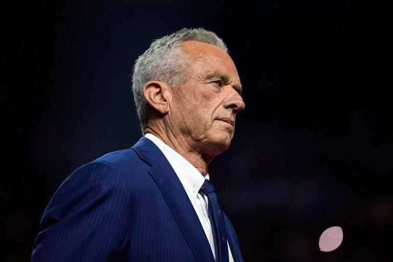 Independent presidential candidate Robert F. Kennedy Jr. listens before endorsing Republican presidential nominee former President Donald Trump at a campaign rally at the Desert Diamond Arena, Friday, Aug. 23, 2024, in Glendale, Ariz.