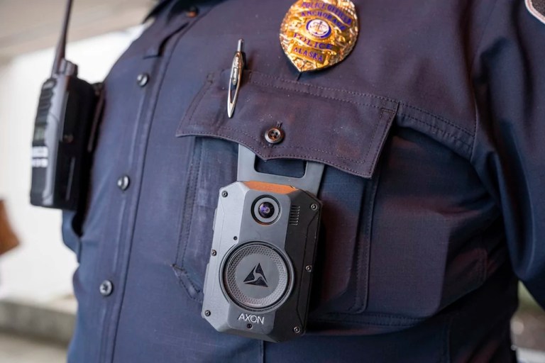 FILE - A police officer wears an Axon body camera on March 28, 2024, at Chugiak High School in Anchorage, Alaska. (Loren Holmes/Anchorage Daily News via AP File)