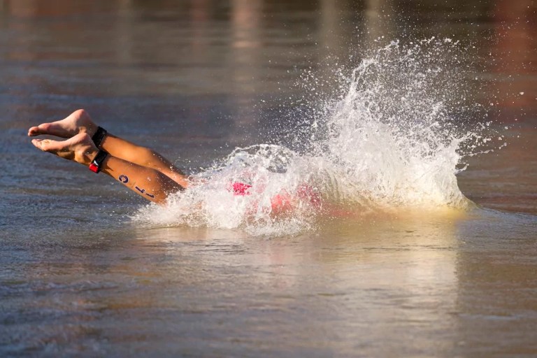 Olympic mixed relay triathlon proceeds in Seine River despite athletes falling ill