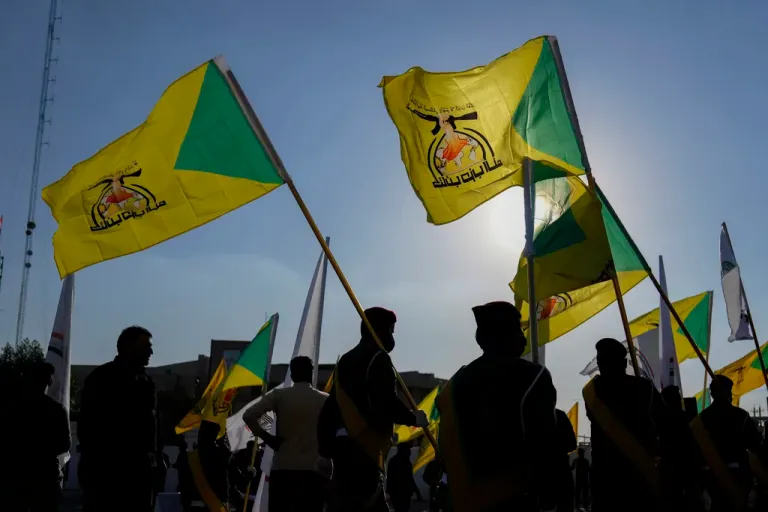 Fighters from the Popular Mobilization Forces attend the funeral of a commander from the Kataib Hezbollah paramilitary group killed in a U.S. airstrike.