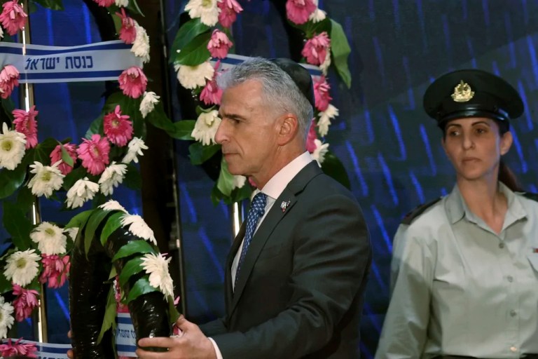 Mossad intelligence agency chief David Barnea lays a wreath during a ceremony marking Memorial Day for fallen soldiers of Israel's wars and victims of attacks at Jerusalem's Mount Herzl military cemetery Monday, May 13, 2024. (Gil Cohen-Magen/Pool Photo via AP)