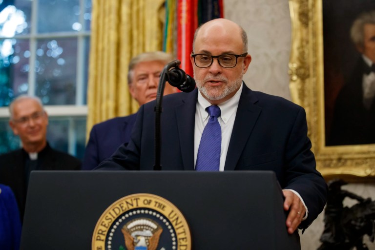 Mark Levin speaks, with President Donald Trump behind him, during a ceremony to present the Presidential Medal of Freedom to former Attorney General Edwin Meese, in the Oval Office of the White House, Tuesday, Oct. 8, 2019, in Washington.