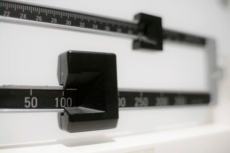 This file photo shows a closeup of a beam scale in New York.