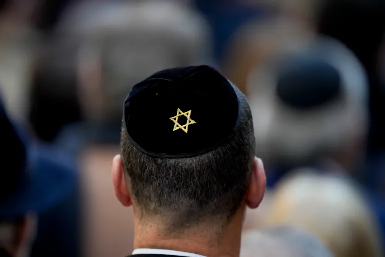 The Star of David decorates the kippah of a participant at a ceremony.