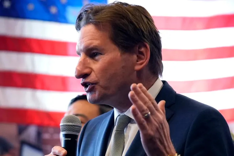 Democratic presidential candidate Rep. Dean Phillips, D-Minn., gestures while addressing a gathering during a campaign stop, Thursday, Jan. 18, 2024, in Manchester, N.H.