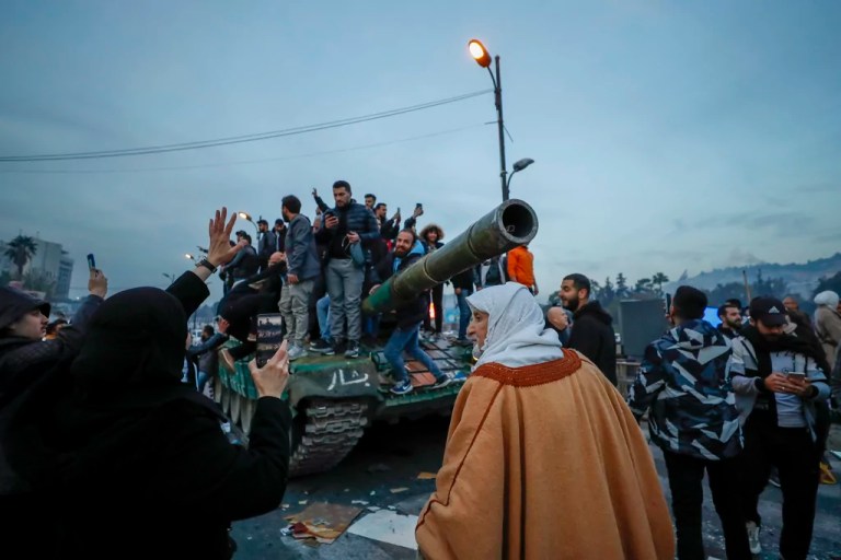 Syrian government falls: Looting and celebrations mark end of over half-century of Assad rule