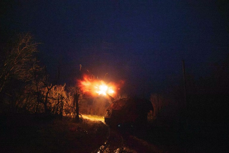 A Ukrainian AS-90 self-propelled artillery vehicle fires toward Russian positions.
