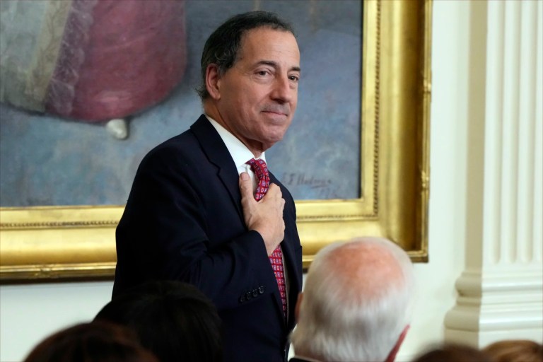 Rep. Jamie Raskin (D-MD) stands as President Joe Biden speaks.