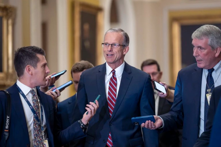Senate Majority Leader John Thune (R-SD) walks with reporters on the way to being elected to succeed longtime GOP leader Mitch McConnell of Kentucky, at the Capitol in Washington, Wednesday, Nov. 13, 2024.