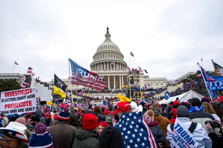 In this Jan. 6, 2021, file photo, insurrections loyal to President Donald Trump rally at the Capitol in Washington. Capitol Police officers who were attacked and beaten during the Capitol riot filed a lawsuit Thursday, Aug. 26, against Trump, his allies, and members of far-right extremist groups, accusing them of intentionally sending insurrectionists to disrupt the congressional certification of the election in January. (AP Photo/Jose Luis Magana, File)
