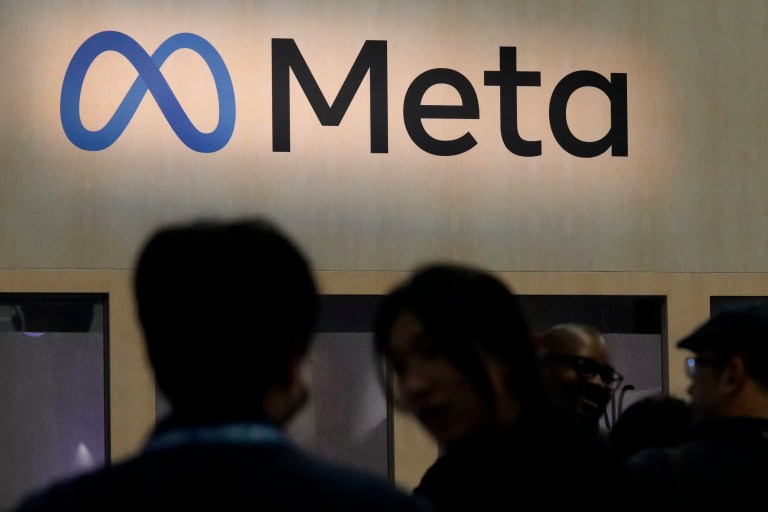 Attendees visit the Meta booth at the Game Developers Conference in San Francisco, March 22, 2023.