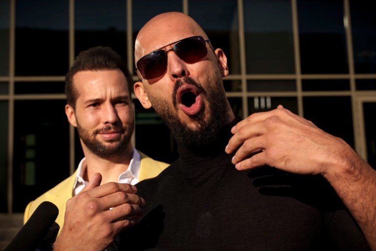 Andrew Tate gestures, next to his brother, Tristan, outside the Bucharest Tribunal in Bucharest, Romania, Thursday, Jan. 9, 2025.