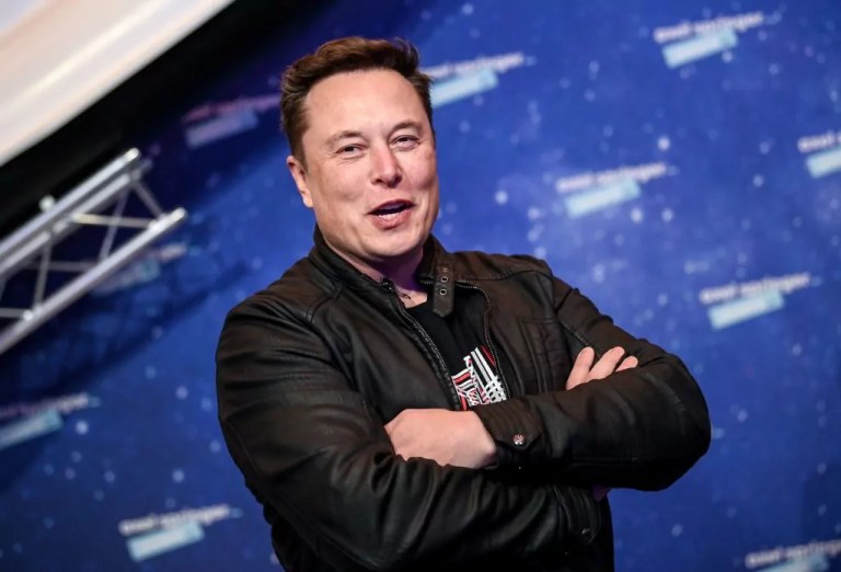 Elon Musk poses as he arrives on the red carpet for the Axel Springer Awards ceremony, in Berlin, Dec. 1, 2020.