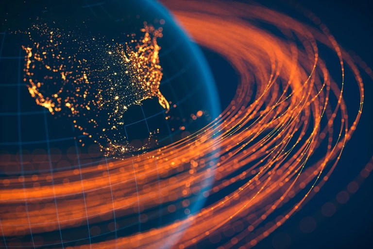 A picture of the Earth from space with glowing orange rings around it representing communication.