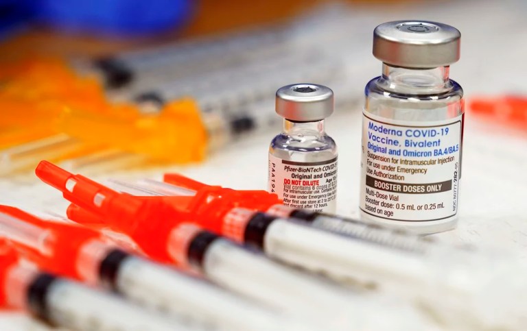 Pfizer, left, and Moderna bivalent COVID-19 vaccines are readied for use at a clinic, Nov. 17, 2022, in Richmond, Virginia. The Biden administration will end most of the last remaining federal COVID-19 vaccine requirements next week when the national public health emergency for the coronavirus ends, the White House said Monday, May 1, 2023.