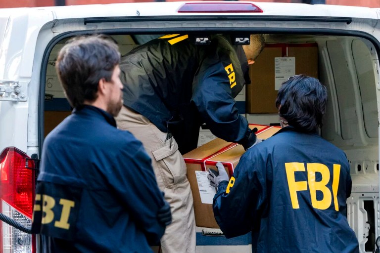 Federal agents load a vehicle with evidence boxes taken from a property related to Russian oligarch Oleg Deripaska, Tuesday, Oct. 19, 2021, in New York. Earlier, an agency spokesperson says FBI agents were at a home in Washington connected to Deripaska to carry out 