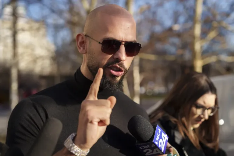 Andrew Tate gestures while speaking outside the Bucharest Tribunal in Bucharest, Romania, Thursday, Jan. 9, 2025.