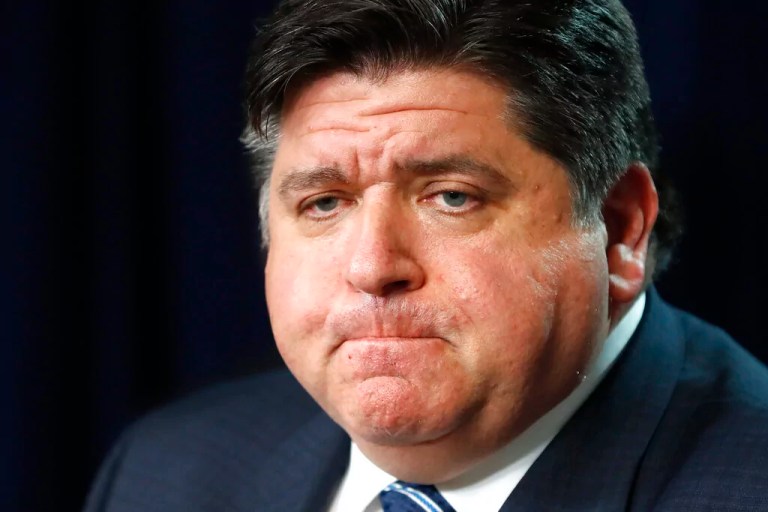 Illinois Gov. J.B. Pritzker listens to a question after announcing that three more people have died in the state from the coronavirus, two Illinois residents and one woman visiting from Florida, during a news conference Thursday, March 19, 2020, in Chicago. (AP Photo/Charles Rex Arbogast)