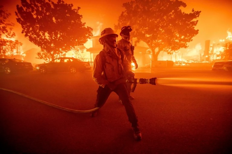 Firefighters do battle with one of the Los Angeles wildfires.