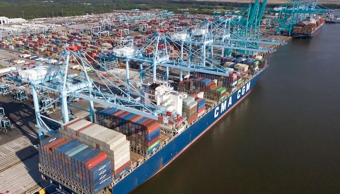 In this May 10, 2019, file photo, a container ship is unloaded at the Virginia International Gateway terminal in Norfolk. A Chinese state news agency said U.S. and Chinese trade negotiators promised to create “favorable conditions” for carrying out a truce in their governments’ tariff war during a phone call.