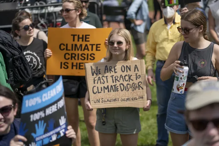 Activists display placards during a rally to mark Earth Day at Lafayette Square, Washington, Saturday, April 23, 2022. The day after Earth Day, the League of Conservation Voters, SEIU, NAACP, Sierra Club, Sunrise Movement, Center for Popular Democracy, MoveOn, The Center for American Progress, and Green New Deal Network join more than 20 partner organizations in a nationwide mobilization, just as President Joe Biden and Congress are on the verge of taking climate action at the scale the crisis demands. (AP Photo/Gemunu Amarasinghe)