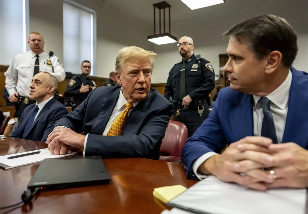 Former President Donald Trump, center, sits in Manhattan Criminal Court with his attorneys Emil Bove, left, and Todd Blanche, Tuesday, May 21, 2024 in New York. (Mark Peterson/Pool Photo via AP)