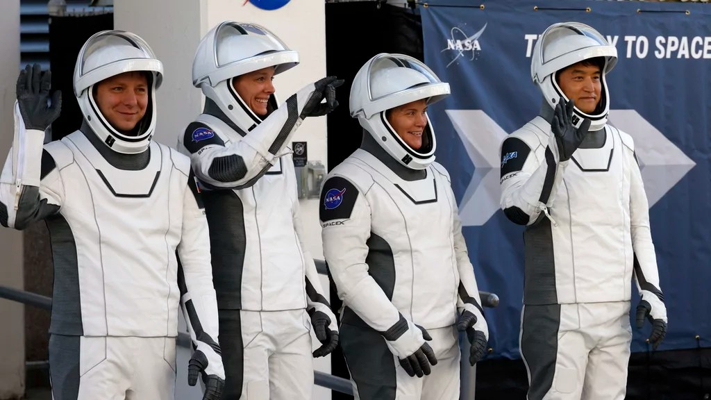 Crew 10, from left, cosmonaut Kirill Peskov, astronaut Nichole Ayers, astronaut Anne McClain and JAXA astronaut Takuya Onishi leave the Operations and Checkout building before heading to Launch Pad 39-A at the Kennedy Space Center in Cape Canaveral, Fla., for a mission to the International Space Station, Wednesday, March 12, 2025.