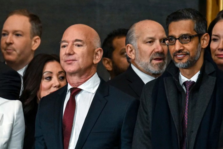 Jeff Bezos, left, and Sundar Pichai, right, stand before the 60th Presidential Inauguration in the Rotunda of the U.S. Capitol in Washington, Monday, Jan. 20, 2025.